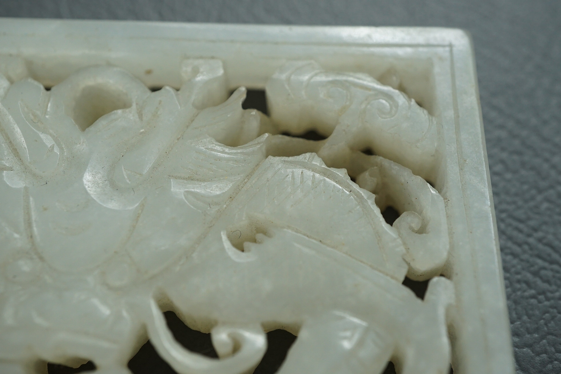 A Chinese white and black jade figure of a recumbent tiger, Song dynasty